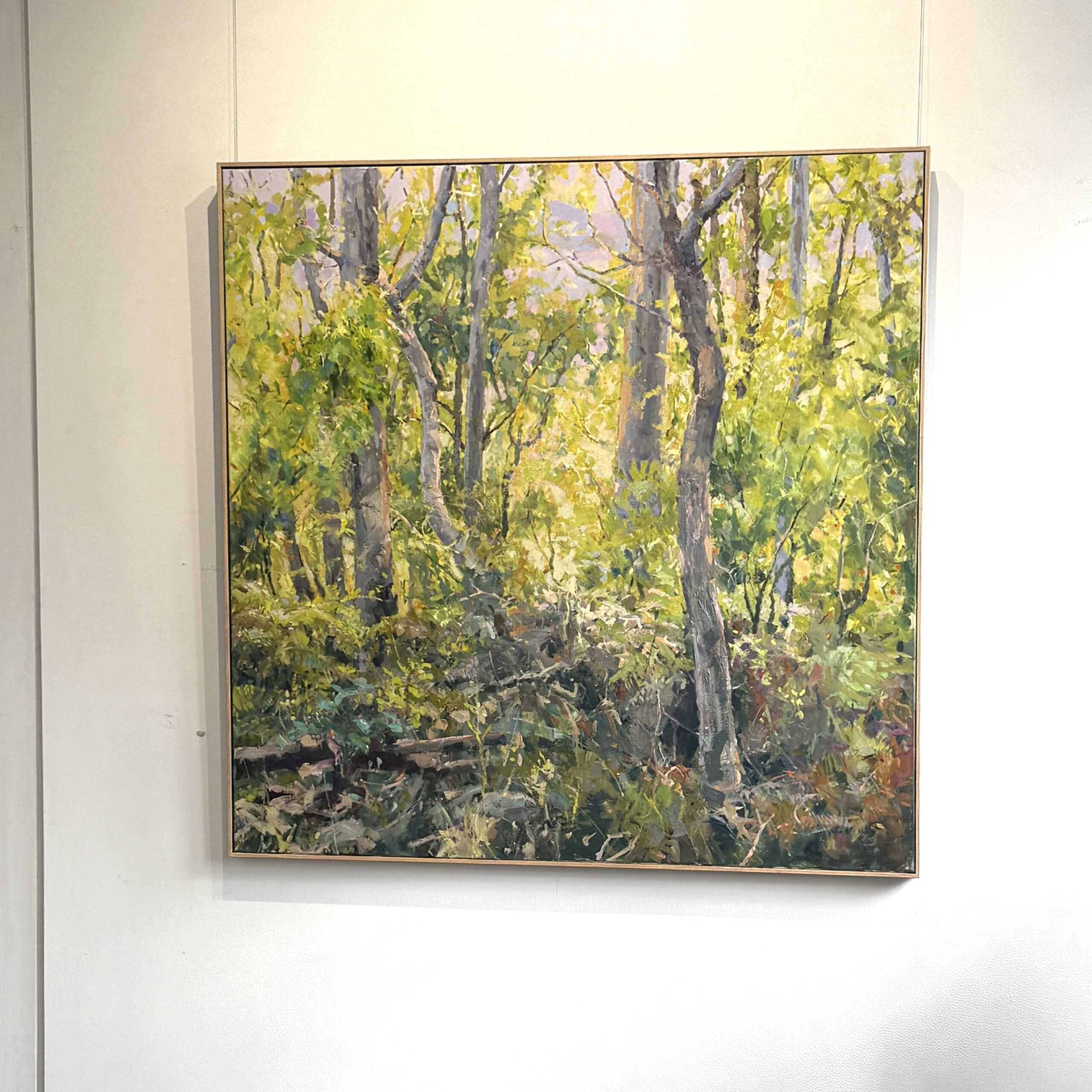 Image of oil paintingof forest with light in the background 